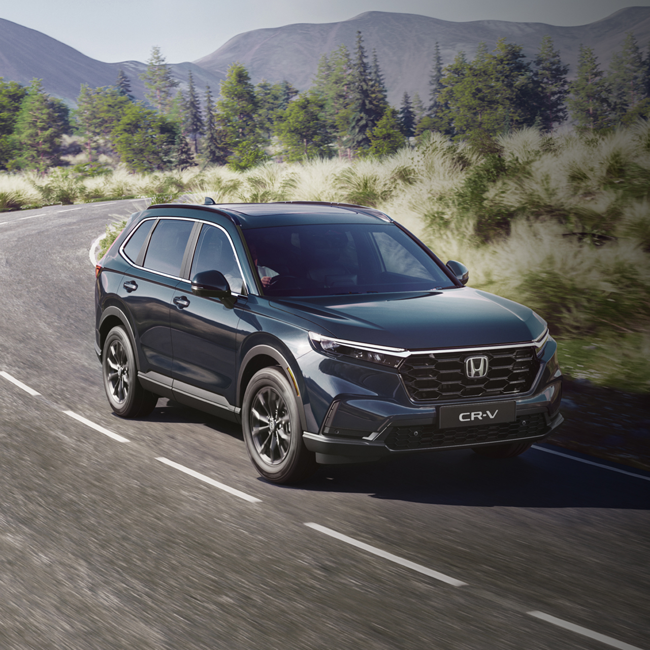 Honda CR-V in black driving down a country road